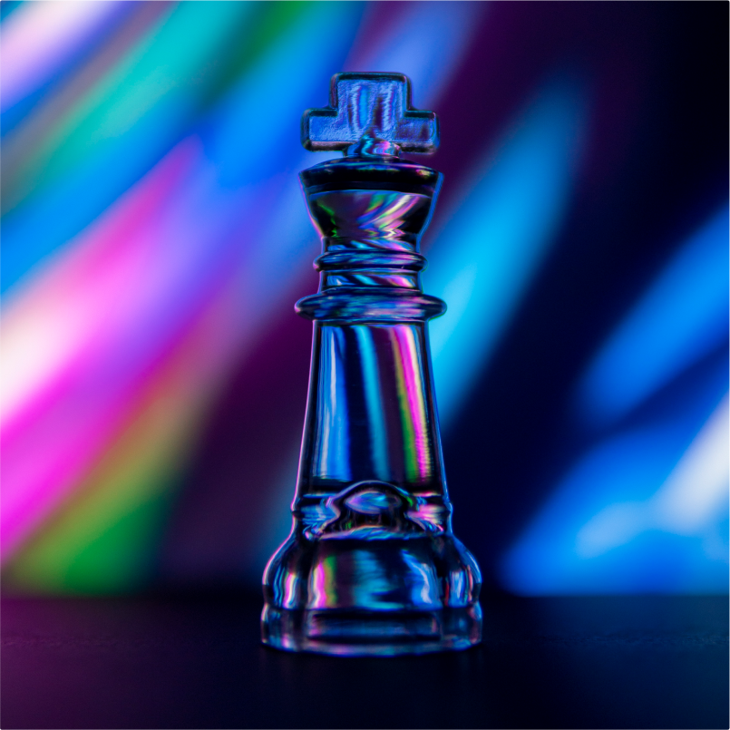 A king chess piece sitting front of an aurora of lights.